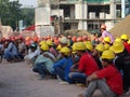 Construction workers gathered in the open space at the construction site to hear morning talks.