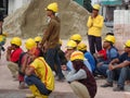 Construction workers gathered in the open space at the construction site to hear morning talks.