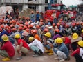 Construction workers gathered in the open space at the construction site to hear morning talks.