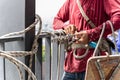 Construction workers holding steel hooks connecting with rope for self absorber safety device equipment. Royalty Free Stock Photo