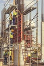 Construction workers installing concrete pillar mold 5