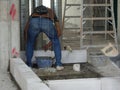 Construction workers installing lightweight block bricks to become wall at the construction site. Royalty Free Stock Photo