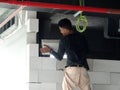 Construction workers installing lightweight block bricks to become wall at the construction site. Royalty Free Stock Photo
