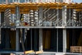 Construction workers installing mounting horizontal formwork on the building construction site. Royalty Free Stock Photo