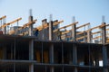 Construction workers installing mounting horizontal formwork on the building construction site. Royalty Free Stock Photo