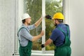 Construction workers installing new window Royalty Free Stock Photo