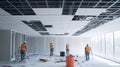 Construction Workers Installing a Suspended Ceiling in an Office Building Royalty Free Stock Photo