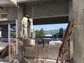 Construction workers laying autoclaved aerated concrete block at the construction site.