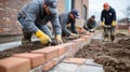 Construction Workers Laying Bricks for a New Wall Royalty Free Stock Photo