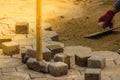 Construction workers are laying concrete pavement stone for footpath work at the construction site. Paving stone worker is putting Royalty Free Stock Photo