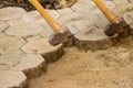 Construction workers are laying concrete pavement stone for footpath work at the construction site. Paving stone worker is putting Royalty Free Stock Photo