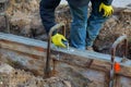 Construction workers leveling concrete pavement Royalty Free Stock Photo