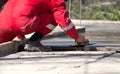 Construction workers leveling concrete pavement. Royalty Free Stock Photo