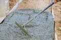 Construction workers leveling pavement concrete sidewalk in new residential home Royalty Free Stock Photo