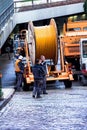 Construction workers make repair urban engineering. Replacement of cable laying modern optical communication Royalty Free Stock Photo