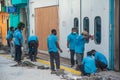 Construction workers in masks working at the street during corona virus pandemic