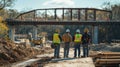 Construction Workers Observing Bridge Construction Royalty Free Stock Photo