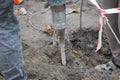 Workers using a jackhammer in a construction area Royalty Free Stock Photo