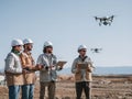 Construction Workers Operating Drones for Surveying on a Sunny Day Royalty Free Stock Photo