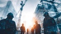 Construction workers overseeing a building project with cranes and scaffolding Royalty Free Stock Photo