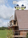 Construction workers perched on a roof Royalty Free Stock Photo