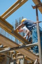 Construction workers placing formwork beams