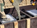 Construction workers are pooring concrete to formwork Royalty Free Stock Photo