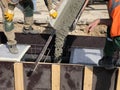 Construction workers are pooring concrete to formwork Royalty Free Stock Photo