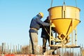 Construction workers pouring concrete in form Royalty Free Stock Photo