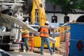 Construction workers pouring concrete