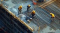 Construction Workers Pouring Concrete on a Rebar Grid Royalty Free Stock Photo