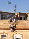 Construction workers renovating the facade of a old house Royalty Free Stock Photo