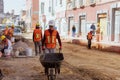 Construction workers repair a road in the Historic Center of Puebla