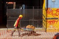 Construction workers repair a road in the Historic Center of Puebla