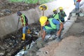 construction workers repairing water pipes