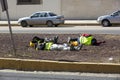 Construction workers resting on the street at lunchtime Royalty Free Stock Photo