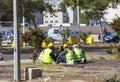 Construction workers resting on the street at lunchtime