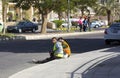 Construction workers resting on the street at lunchtime