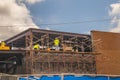 Construction workers on a roof working on a building Royalty Free Stock Photo