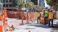 Construction Workers in Safety Vests Near a Construction Zone Royalty Free Stock Photo