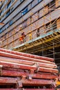 Construction workers on scaffolding on building site