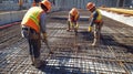 Construction Workers Securing Rebar Grid for Concrete Pour Royalty Free Stock Photo