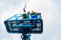 Construction workers on site in hydraulic lifting ramp Royalty Free Stock Photo