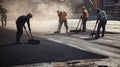 Construction Workers Spreading Asphalt with Shovels Royalty Free Stock Photo