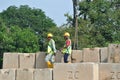 Construction workers stacking the maintain load test block at the construction site. Royalty Free Stock Photo