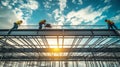 Construction Workers on a Steel Frame Building Against a Cloudy Sky Royalty Free Stock Photo