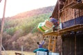 Construction workers thermally insulating house facade, standing