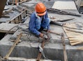 Construction workers using grinders