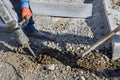 Construction workers using a jackhammer to dig out the concrete surface on the side of the road Royalty Free Stock Photo