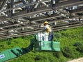 Construction workers using the mobile crane bucket Royalty Free Stock Photo